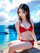 A woman in a red bikini sitting on a wooden dock.